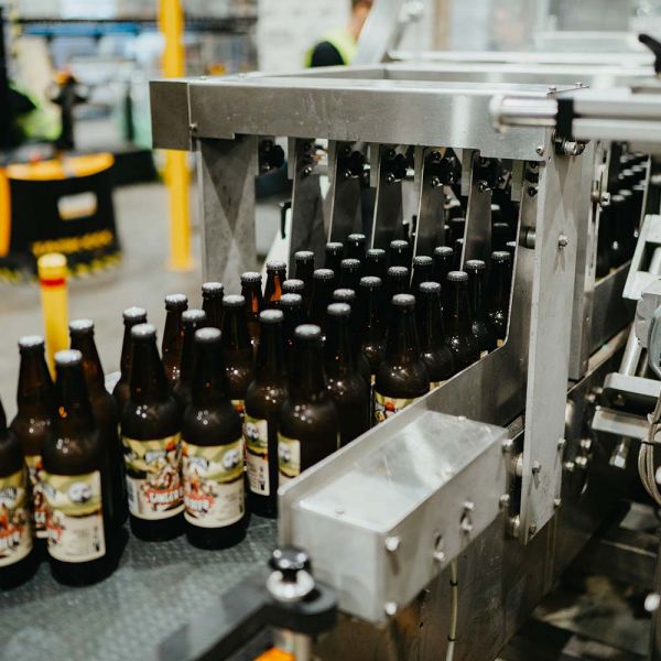 Bottles on Foodmach conveyors at 4 Pines